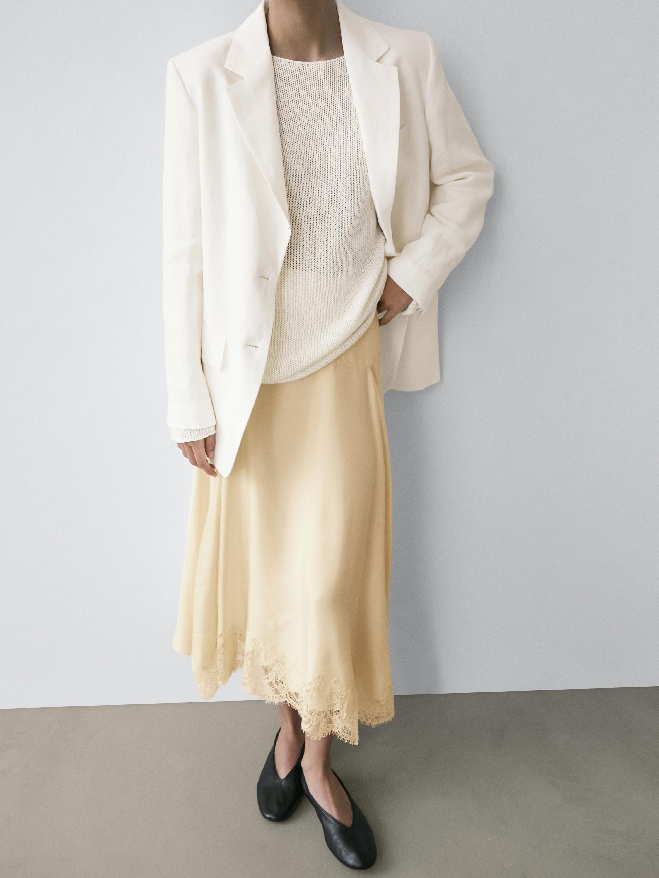 Asymmetric skirt with lace-trimmed detail